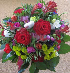 Valentines arrangement made of roses, santini, tulips, alstroemeria, anigoshanthus